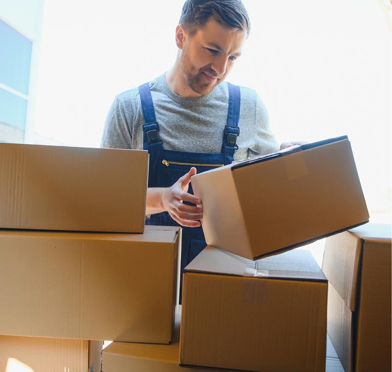A man stacking boxes