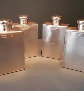 Set of Four Engine Turned Silver Flasks