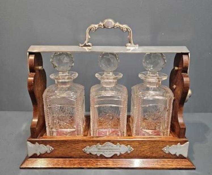 Immaculate Edwardian Oak and Silver Plated 3 Bottle Tantalus - Image 1