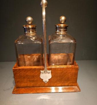 Antique Oak Cased Two Bottle Decanter Set