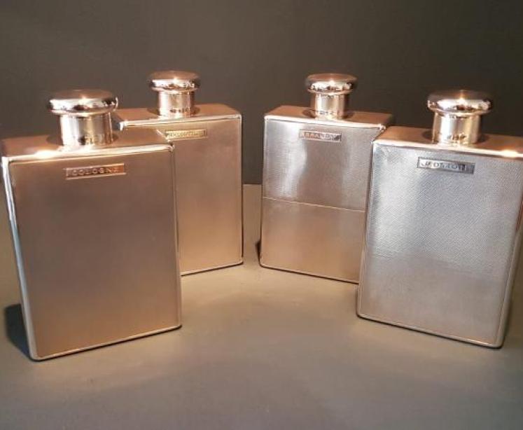 Set of Four Engine Turned Silver Flasks - Image 1