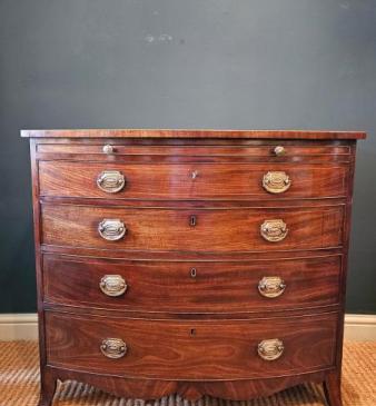 George III Mahogany Bow Front Chest with Brushing Slide