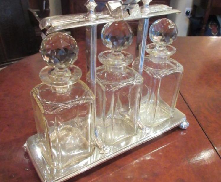 Fine Late Victorian Silvered Three Bottle Tantalus - Image 1